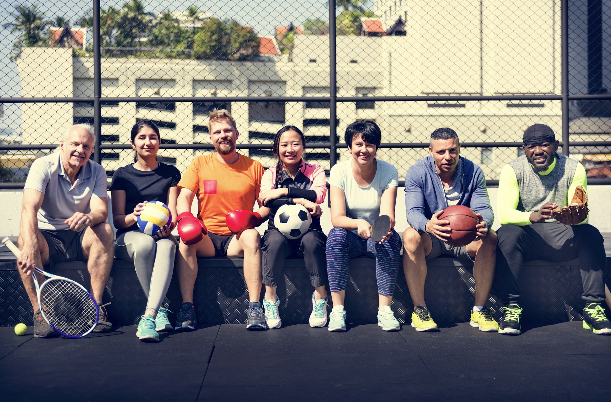 Group of diverse athletes sitting together